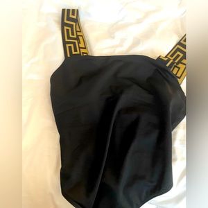 Black Versace bathing suit size large usa European size 4. Worn twice.